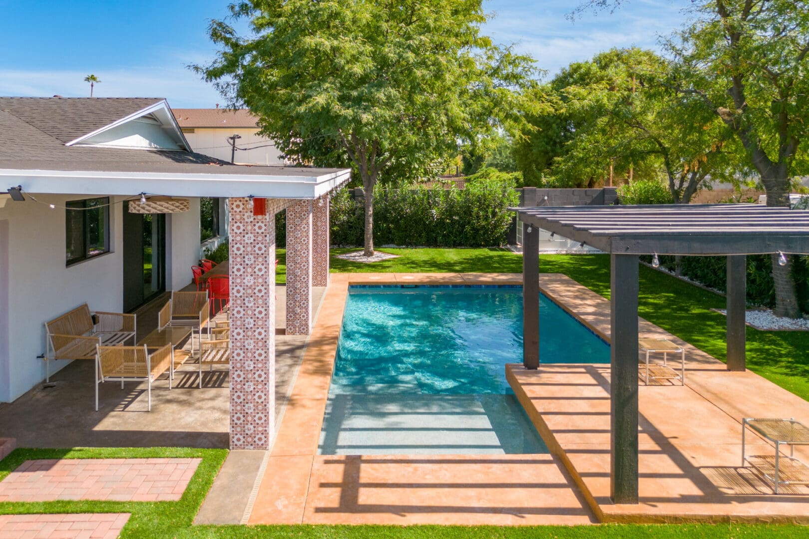 A pool that has been built in the middle of a yard.