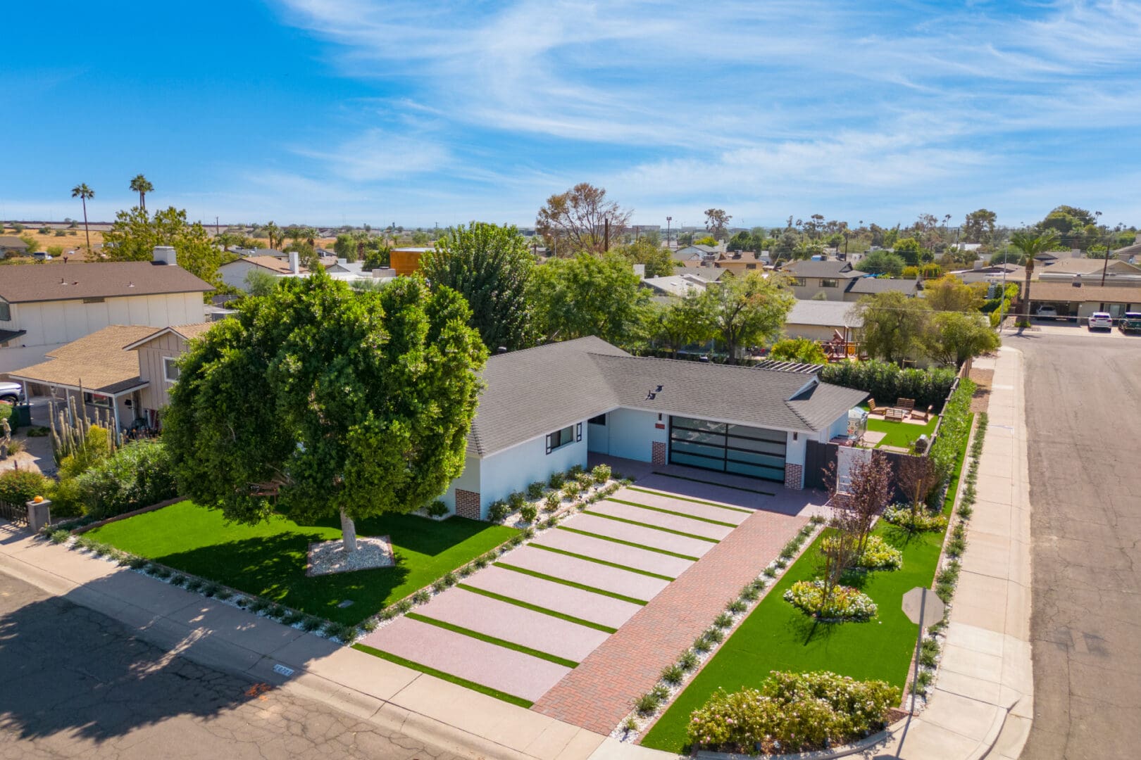 A large house with many cars parked in it