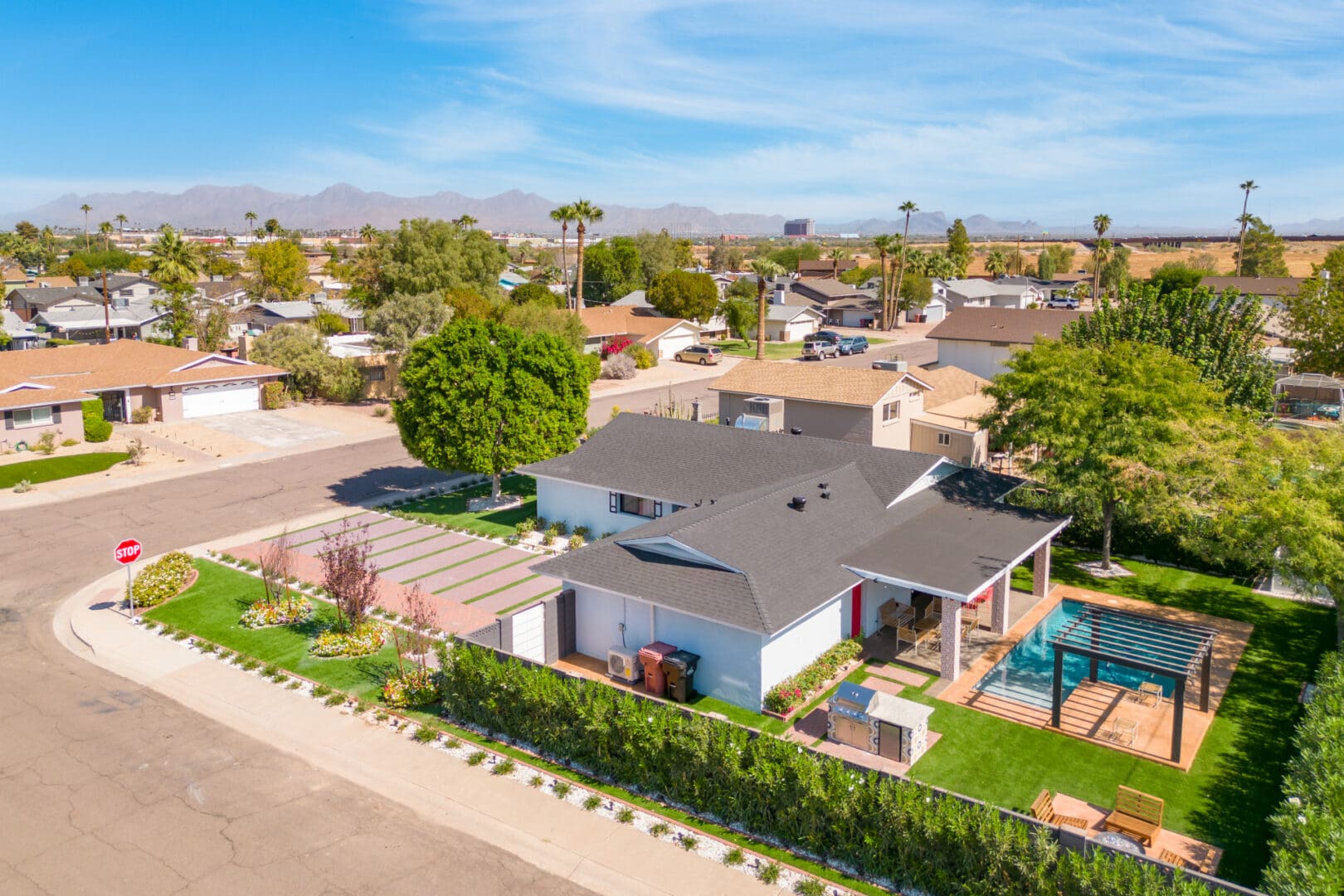 A house with a pool and a fence in the yard.