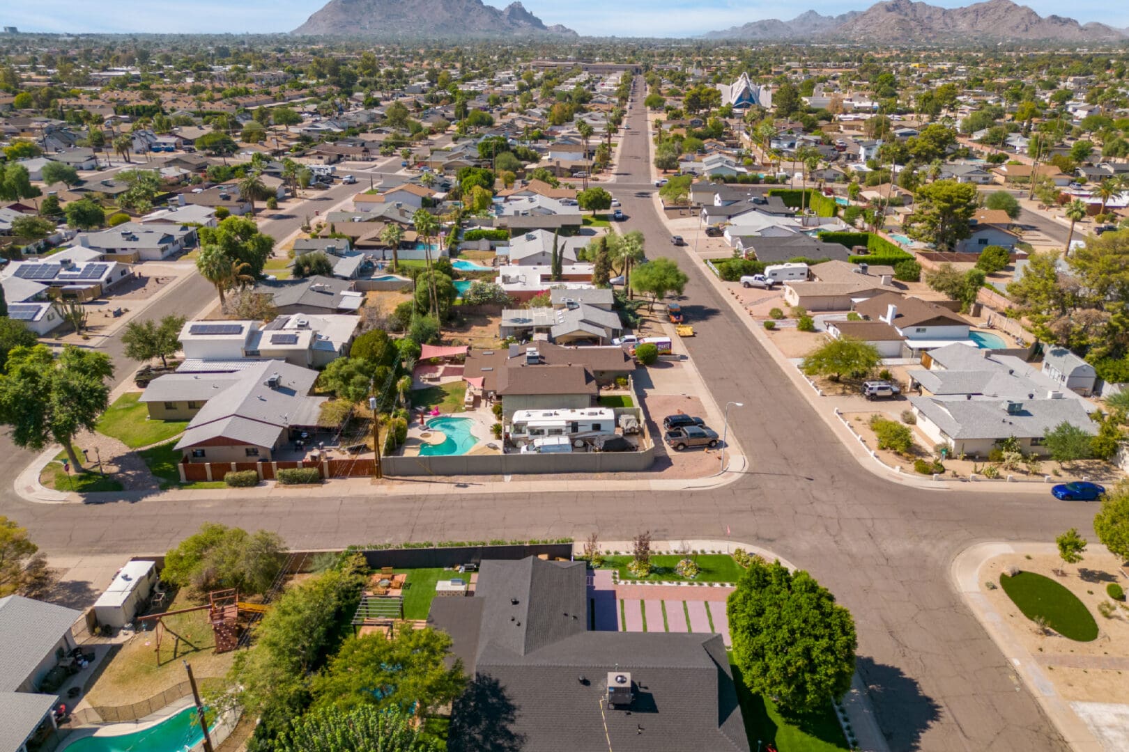 An aerial view of a residential area with houses and streets.