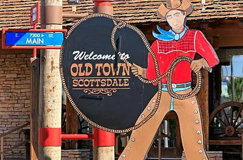 A large sign that says welcome to old town scottsdale.